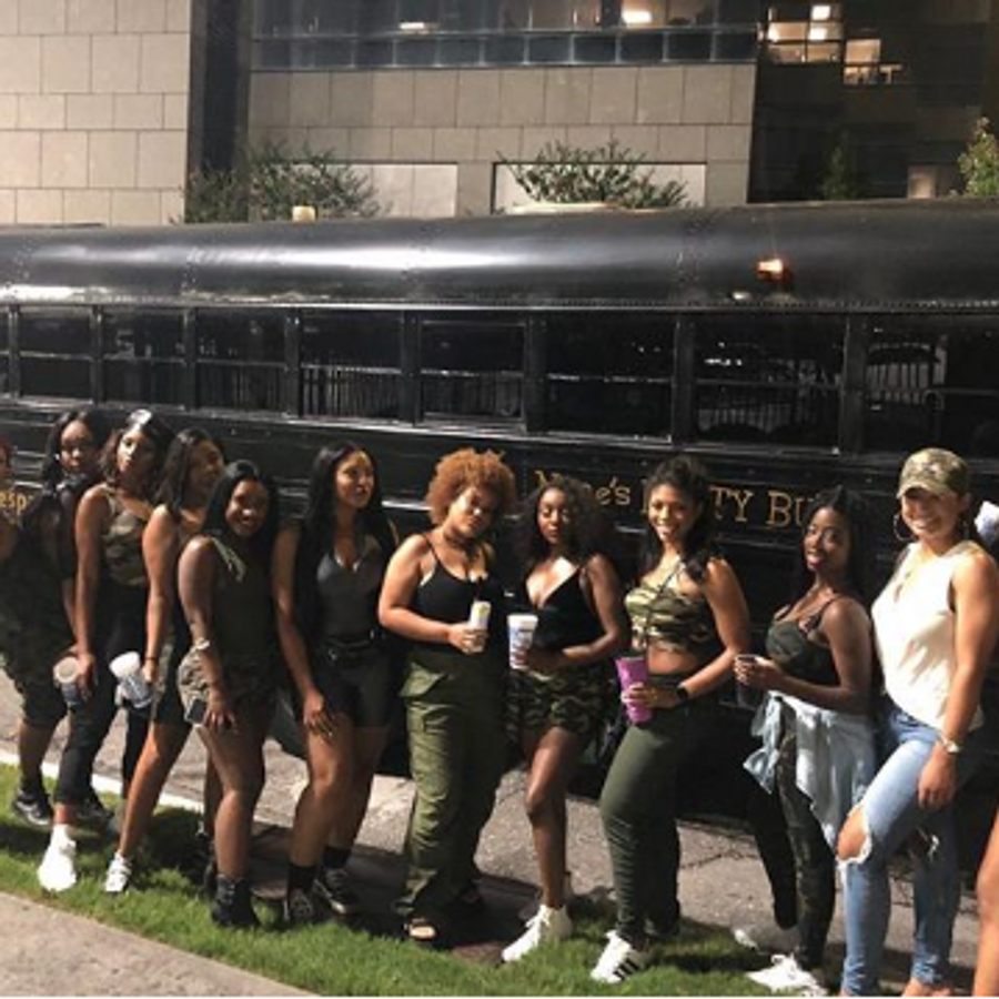 Group lined up beside Nene's Party Bus