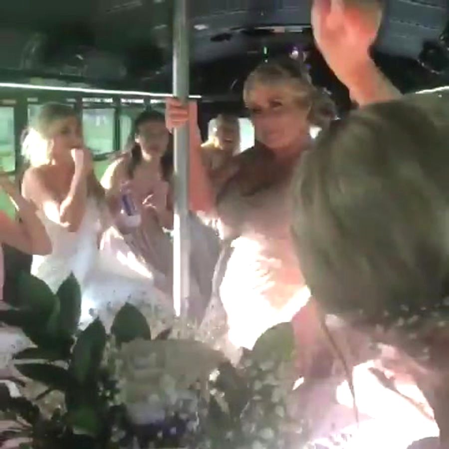 Party group dancing inside Nene's Party Bus